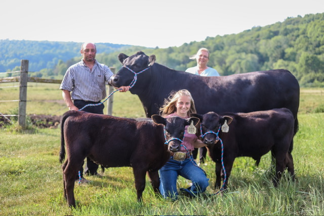 Jeff, Vicky and Alysa Williams with some of their Registered Angus cow and calves